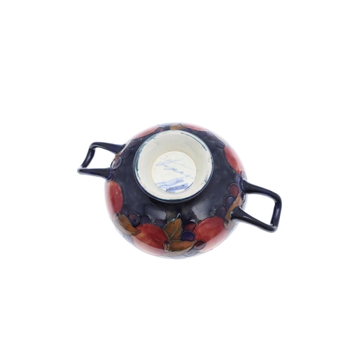 732 - ANTIQUE MOORCROFT TWO HANDLED BOWL, & OTHER ITEMS. A two handled bowl painted in the Pomegranate des... 