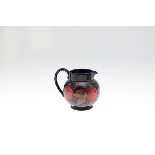 734 - ANTIQUE MOORCROFT JUG & OTHER ITEMS - POMEGRANATE. Including a squat jug painted in the Pomegranate ... 