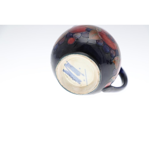 734 - ANTIQUE MOORCROFT JUG & OTHER ITEMS - POMEGRANATE. Including a squat jug painted in the Pomegranate ... 