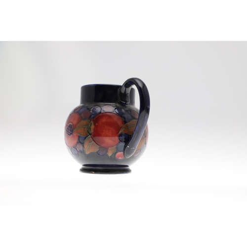 734 - ANTIQUE MOORCROFT JUG & OTHER ITEMS - POMEGRANATE. Including a squat jug painted in the Pomegranate ... 