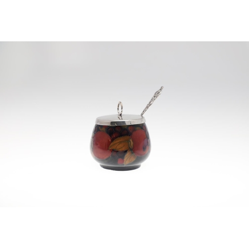 735 - ANTIQUE MOORCROFT ITEMS - POMEGRANATE. A mixed lot including a small slender vase (8.5cms high), a c... 