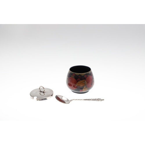 735 - ANTIQUE MOORCROFT ITEMS - POMEGRANATE. A mixed lot including a small slender vase (8.5cms high), a c... 