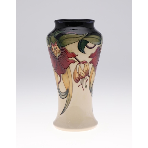 745 - LARGE MOORCROFT TRIAL VASE - ANNA LILY. A modern Moorcroft vase in the Anna Lily vase, in a trial sh... 