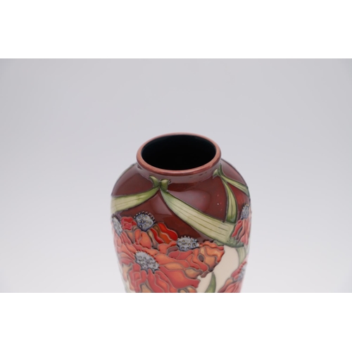 746 - MOORCROFT TRIAL VASE - RUDBEKIA. A large slender trial vase painted in the Rudbekia design, brightly... 