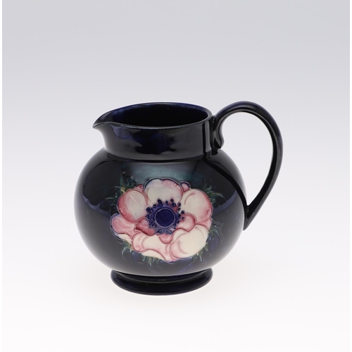 752 - MOORCROFT VASES & JUG. Including a 1930's blue jug (12cms high), a modern Anemone vase painted with ... 