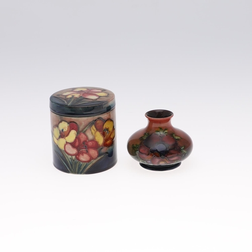 761 - MOORCROFT FLAMBE VASE & LIDDED BOX. A small squat vase painted in the Anemone design with a flambe g... 