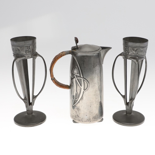 768 - PAIR OF LIBERTY TUDRIC PEWTER VASES & JUG. A pair of spill vases, Model No 0957, each with three ten... 