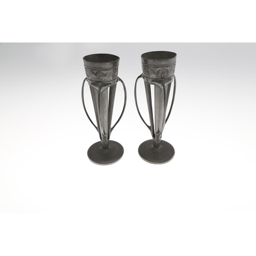 768 - PAIR OF LIBERTY TUDRIC PEWTER VASES & JUG. A pair of spill vases, Model No 0957, each with three ten... 