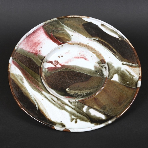 769 - TIM ANDREWS (BORN 1960) - LARGE STONEWARE DISH. (d) A large dish or charger with a circular well, wi... 