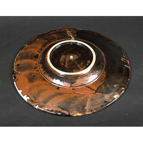 769 - TIM ANDREWS (BORN 1960) - LARGE STONEWARE DISH. (d) A large dish or charger with a circular well, wi... 