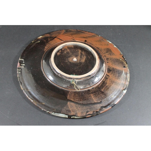 769 - TIM ANDREWS (BORN 1960) - LARGE STONEWARE DISH. (d) A large dish or charger with a circular well, wi... 