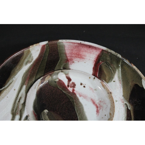 769 - TIM ANDREWS (BORN 1960) - LARGE STONEWARE DISH. (d) A large dish or charger with a circular well, wi... 