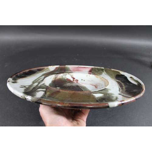 769 - TIM ANDREWS (BORN 1960) - LARGE STONEWARE DISH. (d) A large dish or charger with a circular well, wi... 