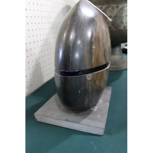 770 - COLUMBIAN SCHOOL - CONTEMPORARY STONEWARE & GLASS SCULPTURE. A large polished circular stoneware dis... 