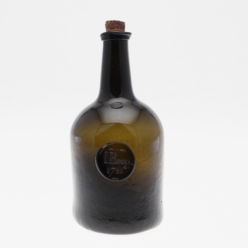 779 - 18THC GLASS SEAL BOTTLE - 1785. The olive green bottle with a tapering neck, string rim and cylindri... 