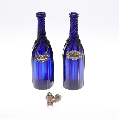 782 - PAIR OF BLUE GLASS DECANTERS & WINE LABELS INCLUDING VICTORIAN SILVER BRANDY LABEL. A pair of blue g... 