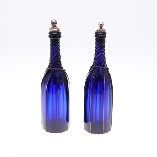 782 - PAIR OF BLUE GLASS DECANTERS & WINE LABELS INCLUDING VICTORIAN SILVER BRANDY LABEL. A pair of blue g... 