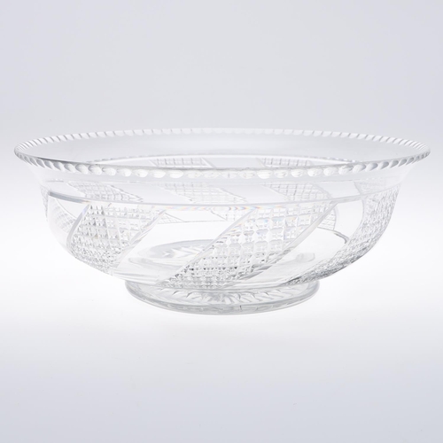 783 - A LARGE CUT GLASS PEDESTAL BOWL. A large bowl probably 19thc, with an indented rim, bands of hob nai... 