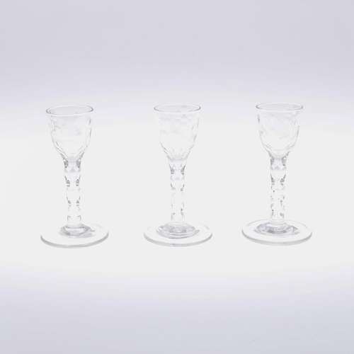 785 - THREE 19THC WINE GLASSES. 19thc in the 18thc style, with a small ogee shaped bowl etched with flower... 