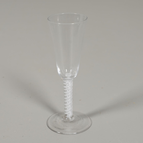 787 - GEORGIAN AIR TWIST WINE GLASS. The glass with an elongated bowl, with an air twist glass stem around... 