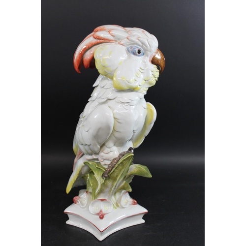 790 - LARGE MEISSEN COCKATOO. 20thc, an unusually large model of a Cockatoo perched amongst foliage, and o... 