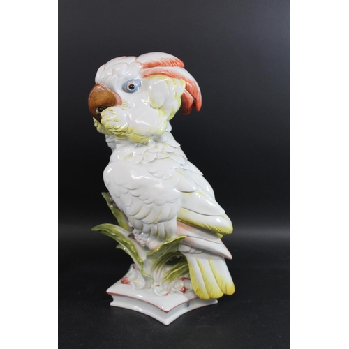 790 - LARGE MEISSEN COCKATOO. 20thc, an unusually large model of a Cockatoo perched amongst foliage, and o... 