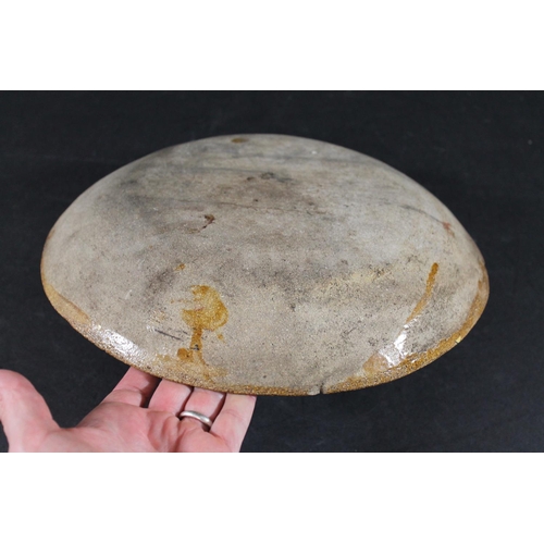 794 - ENGLISH SLIPWARE DISH. Probably 18thc, the deep dish with trails of black slip on an ochre glazed gr... 