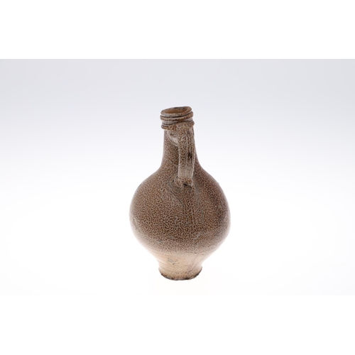 798 - A GERMAN STONEWARE BELLAMINE JUG. Of traditional form with a bearded mask to the neck and foliate me... 