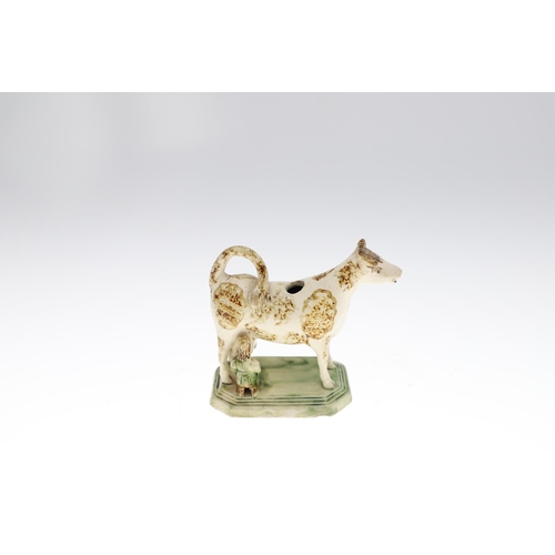 807 - WHIELDON COW CREAMER & TWO OTHER 19THC COW CREAMERS. A Whieldon cow creamer with a rectangular cante... 