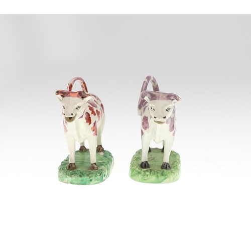 808 - 19THC PEARLWARE COW CREAMERS. Including two similar Cow Creamers with splashes of purple lustre, and... 