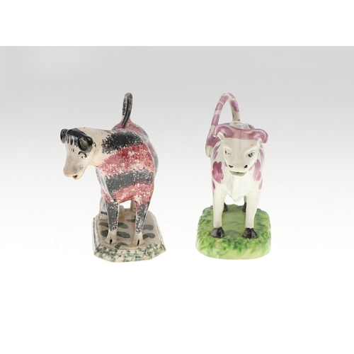 808 - 19THC PEARLWARE COW CREAMERS. Including two similar Cow Creamers with splashes of purple lustre, and... 