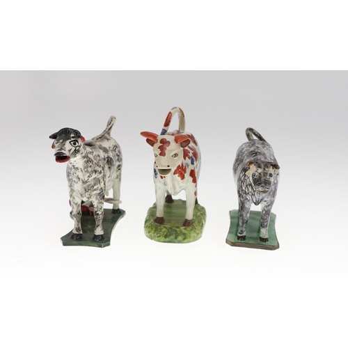 809 - 19THC PRATTWARE COW CREAMER & TWO OTHER COW CREAMERS. Attributed to 'St Anthony's Pottery', with bla... 