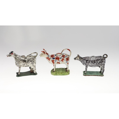 809 - 19THC PRATTWARE COW CREAMER & TWO OTHER COW CREAMERS. Attributed to 'St Anthony's Pottery', with bla... 