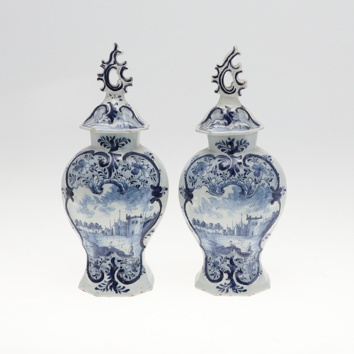 821 - PAIR OF ANTIQUE DELFT LIDDED VASES. 19th, the vases painted with two figures fishing within a landsc... 