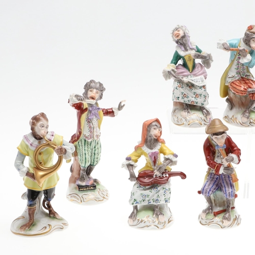 824 - DRESDEN PORCELAIN MONKEY BAND. A set of 11 porcelain figures, each modelled with a Monkey holding an... 