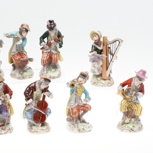 824 - DRESDEN PORCELAIN MONKEY BAND. A set of 11 porcelain figures, each modelled with a Monkey holding an... 