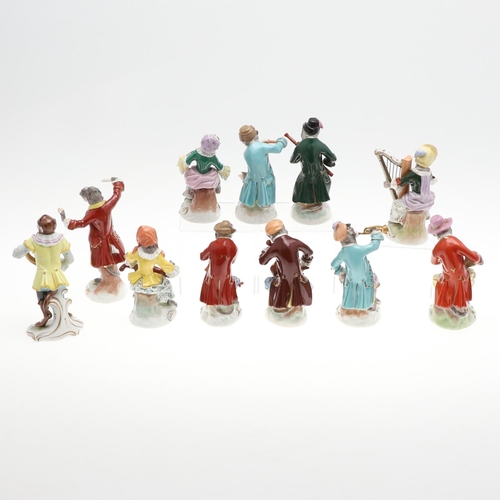 824 - DRESDEN PORCELAIN MONKEY BAND. A set of 11 porcelain figures, each modelled with a Monkey holding an... 