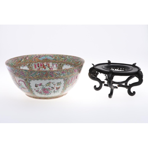 830 - LARGE 19THC CHINESE CANTONESE BOWL & WOODEN STAND. A large 19thc Chinese Cantonese bowl, the interio... 