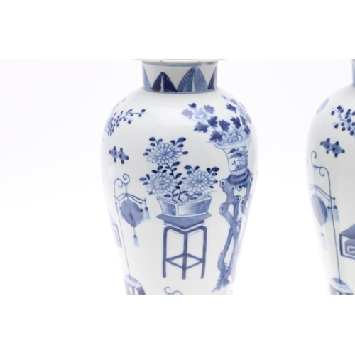 833 - PAIR OF CHINESE 19THC BLUE & WHITE LIDDED VASES. A pair of 19thc baluster shaped lidded vases, paint... 