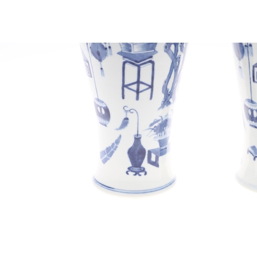 833 - PAIR OF CHINESE 19THC BLUE & WHITE LIDDED VASES. A pair of 19thc baluster shaped lidded vases, paint... 