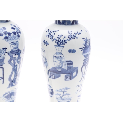 833 - PAIR OF CHINESE 19THC BLUE & WHITE LIDDED VASES. A pair of 19thc baluster shaped lidded vases, paint... 