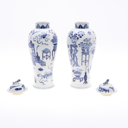 833 - PAIR OF CHINESE 19THC BLUE & WHITE LIDDED VASES. A pair of 19thc baluster shaped lidded vases, paint... 