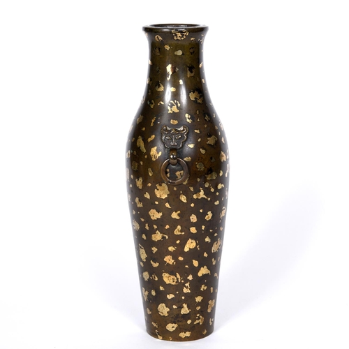 834 - CHINESE BRONZE GOLD SPLASH VASE. Probably 18thc, the large vase of slender form with mask handles su... 