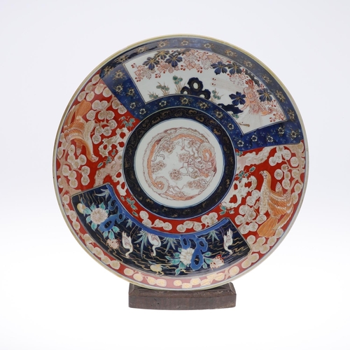 835 - LARGE JAPANESE IMARI CHARGER. Meiji period, the large charger painted in the centre with a Dragon, w... 