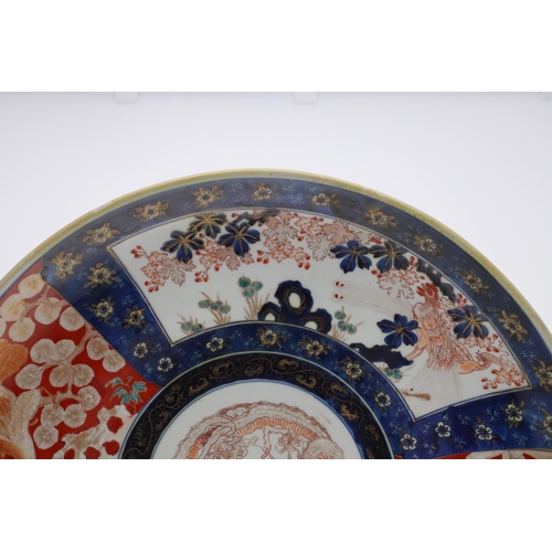 835 - LARGE JAPANESE IMARI CHARGER. Meiji period, the large charger painted in the centre with a Dragon, w... 