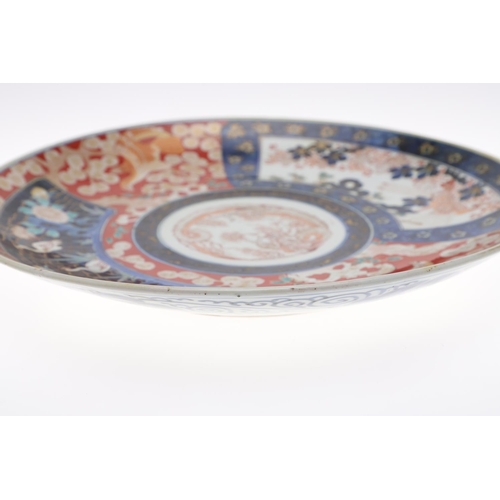 835 - LARGE JAPANESE IMARI CHARGER. Meiji period, the large charger painted in the centre with a Dragon, w... 