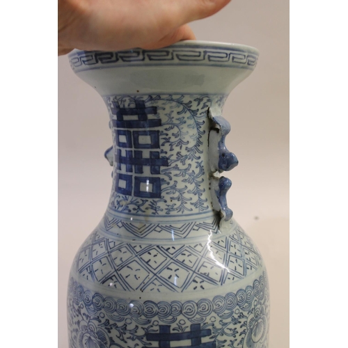 838 - A 19THC CHINESE PROVINCIAL BLUE AND WHITE VASE. A large provincial baluster vase, with sprays of flo... 