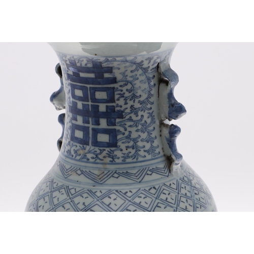 838 - A 19THC CHINESE PROVINCIAL BLUE AND WHITE VASE. A large provincial baluster vase, with sprays of flo... 