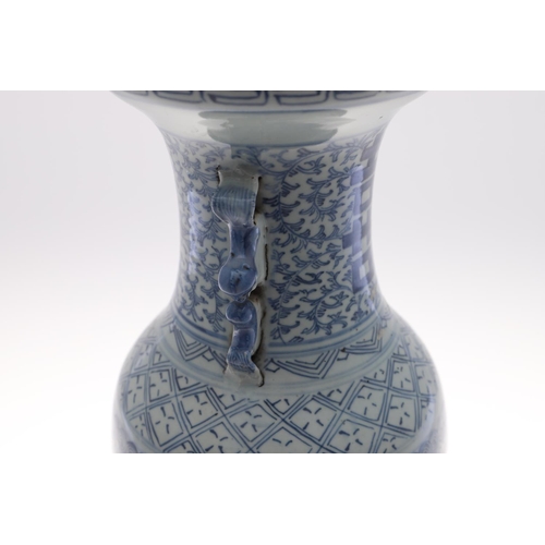 838 - A 19THC CHINESE PROVINCIAL BLUE AND WHITE VASE. A large provincial baluster vase, with sprays of flo... 