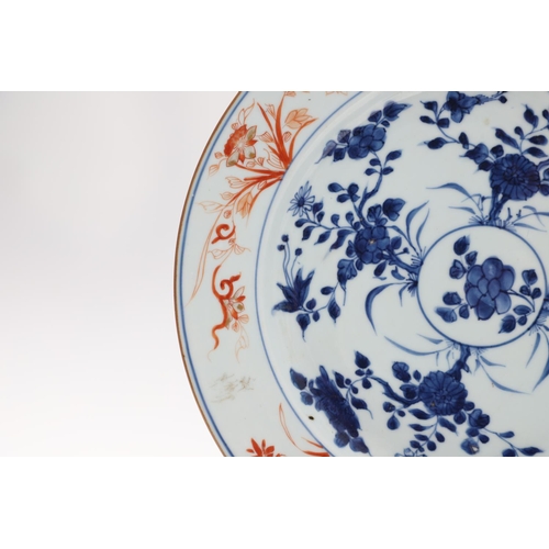 849 - CHINESE KANGXI DISH & ARMORIAL DISH. A Chinese underglaze blue and iron red dish, painted to the cen... 